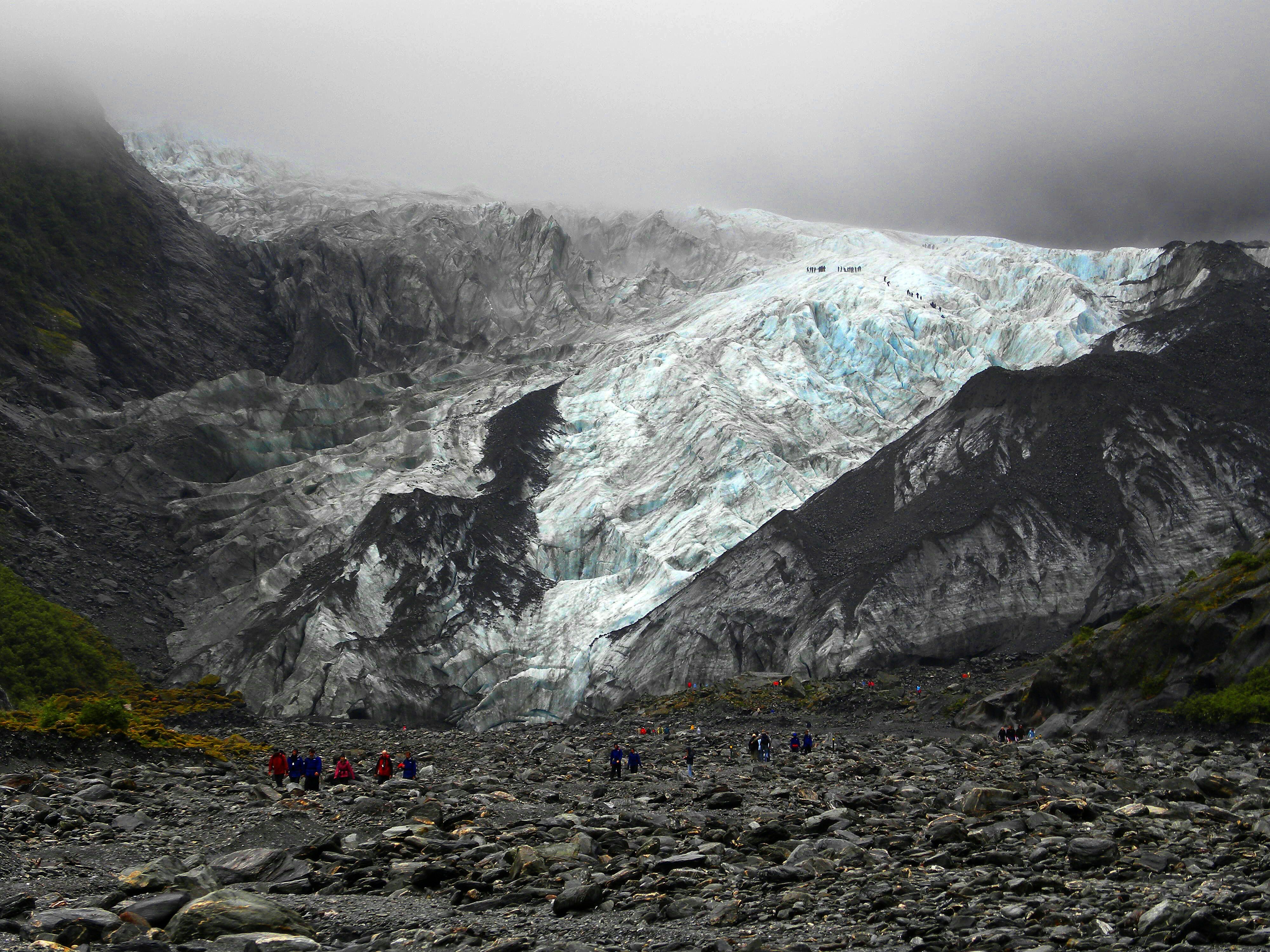 A person climbing a mountain symbolizing reaching milestones and celebrating success