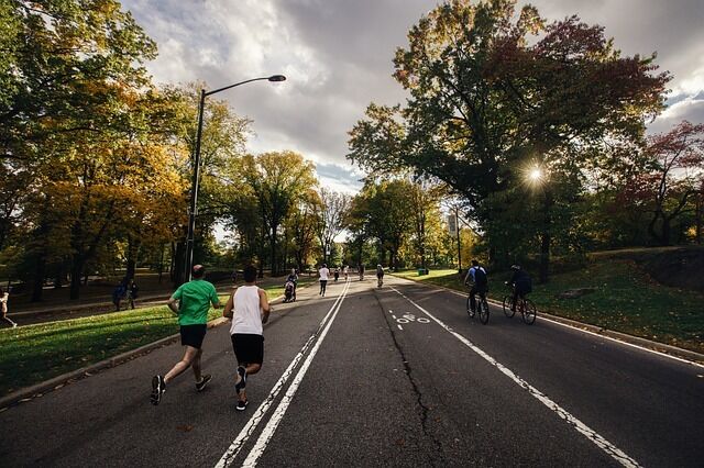 two people running on a road